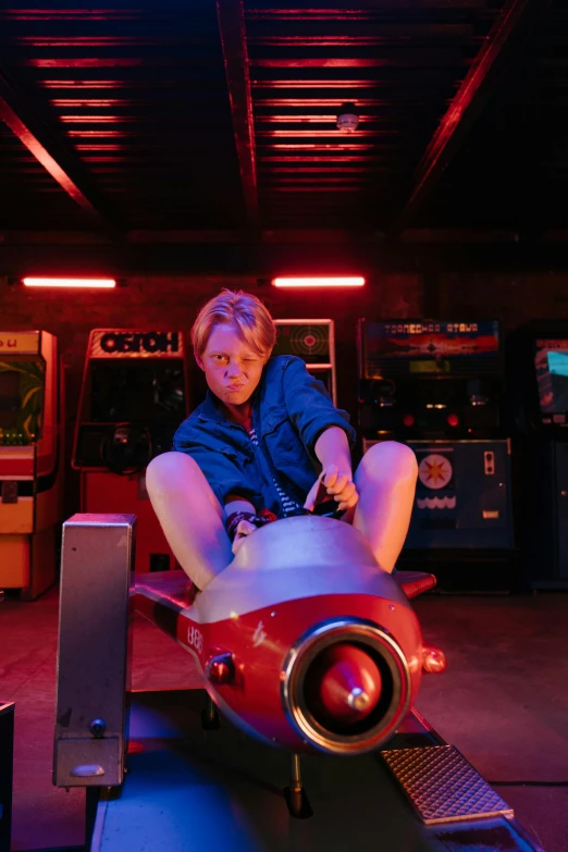 a woman sitting on a toy plane in a garage, by Lee Gatch, unsplash, retrofuturism, 8 0 s neon movie still, gary busey, sitting on a red button, gaming