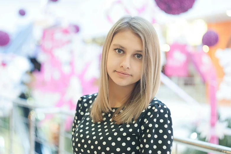 a woman in a polka dot dress posing for a picture, a picture, tumblr, tachisme, appearing in a shopping mall, avatar image, young blonde woman, headshot photograph