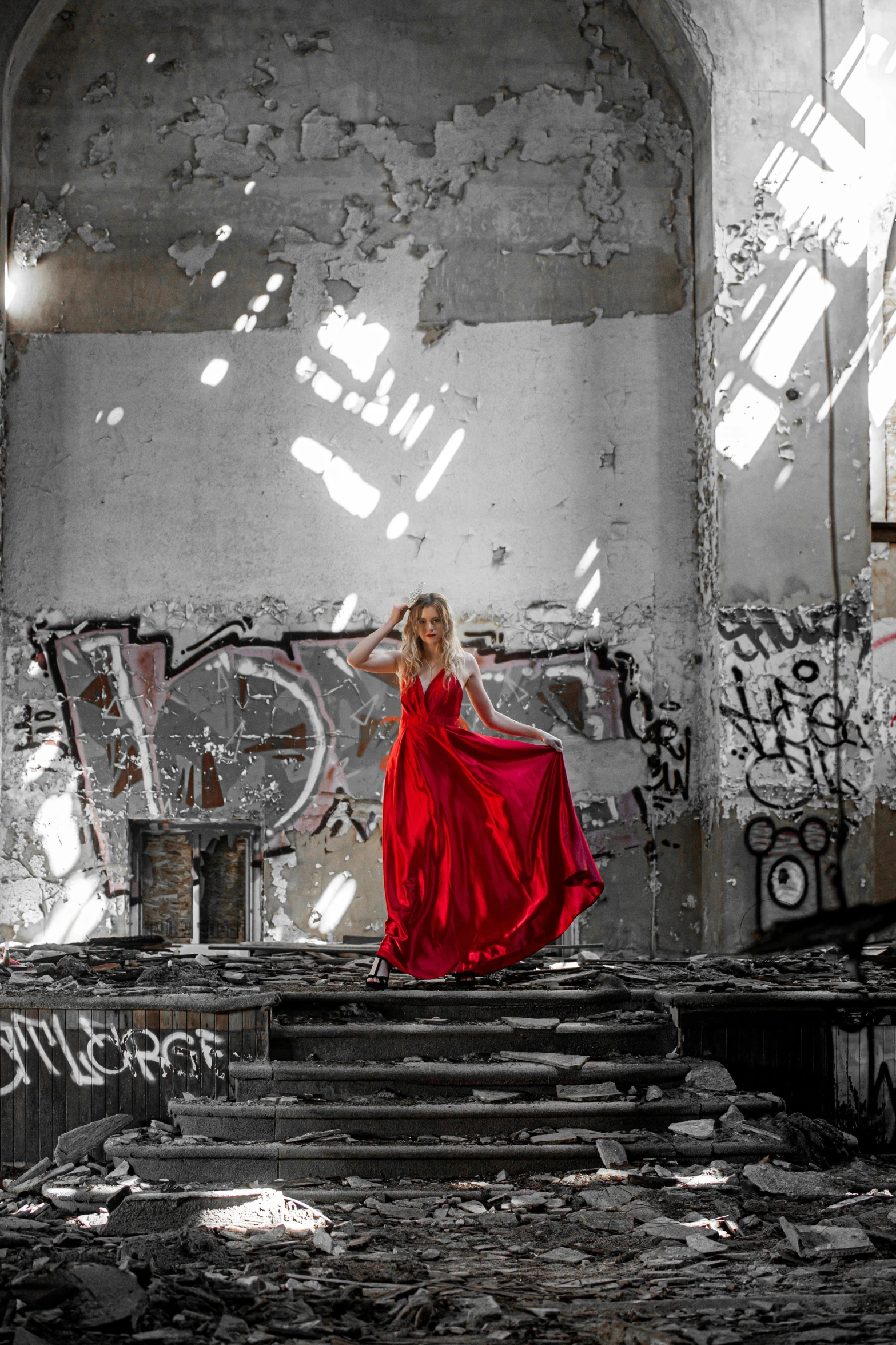 a woman in a red dress standing in an abandoned building, pexels contest winner, graffiti, recital, flowing gown, hollywood promotional image, in front of white back drop