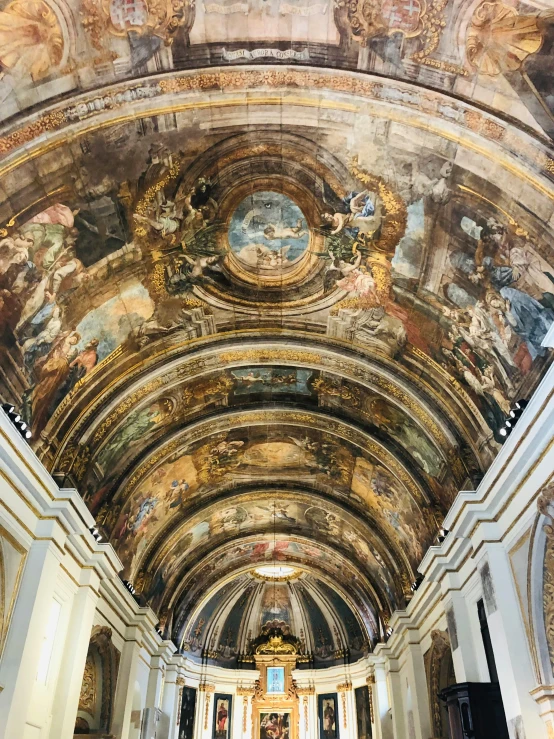 a church filled with lots of paintings on the ceiling, by Cagnaccio di San Pietro, curving geometric arches, 🎨🖌️, high quality photo, carvaggio