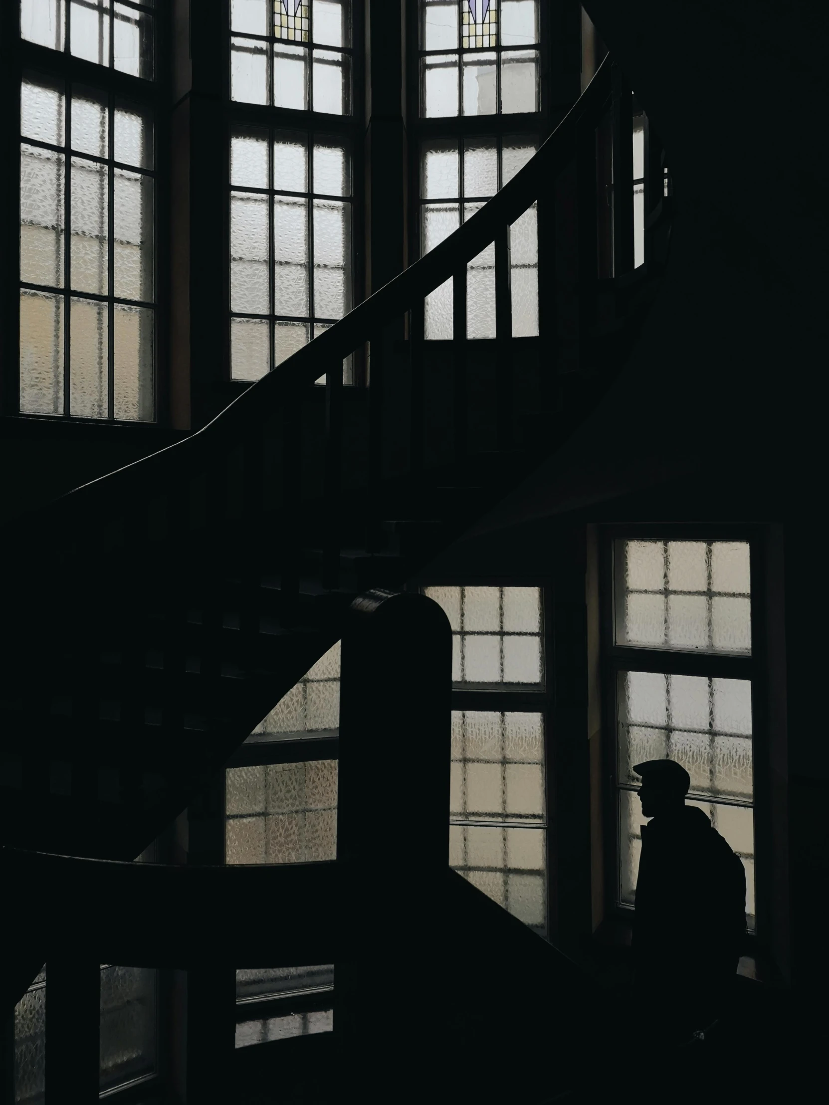 a man walking up a set of stairs in a building, pexels contest winner, tonalism, silhouette :7, historical setting, instagram story, cinematic outfit photo