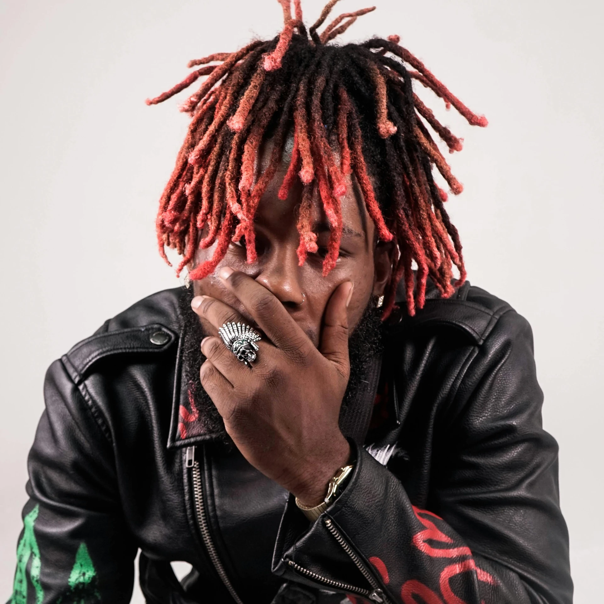 a man with dreadlocks smoking a cigarette, an album cover, trending on pexels, cyberpunk dyed haircut, lil uzi vert, reddish lava highlights, middle finger
