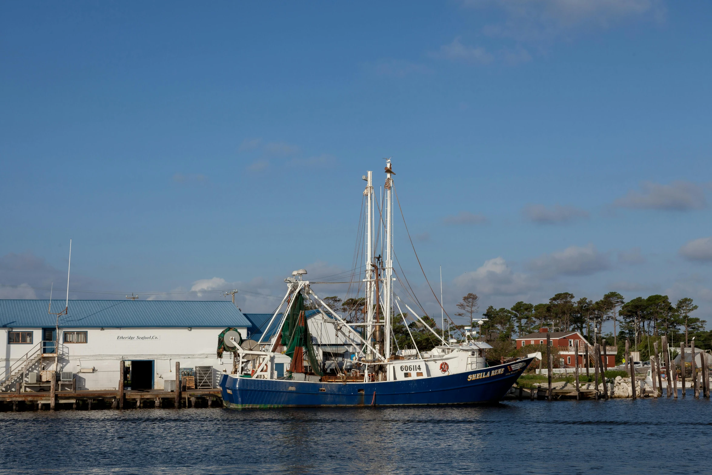 a boat that is sitting in the water, a portrait, by Carey Morris, pexels contest winner, shipyard, alabama, shrimp, 3 / 4 wide shot