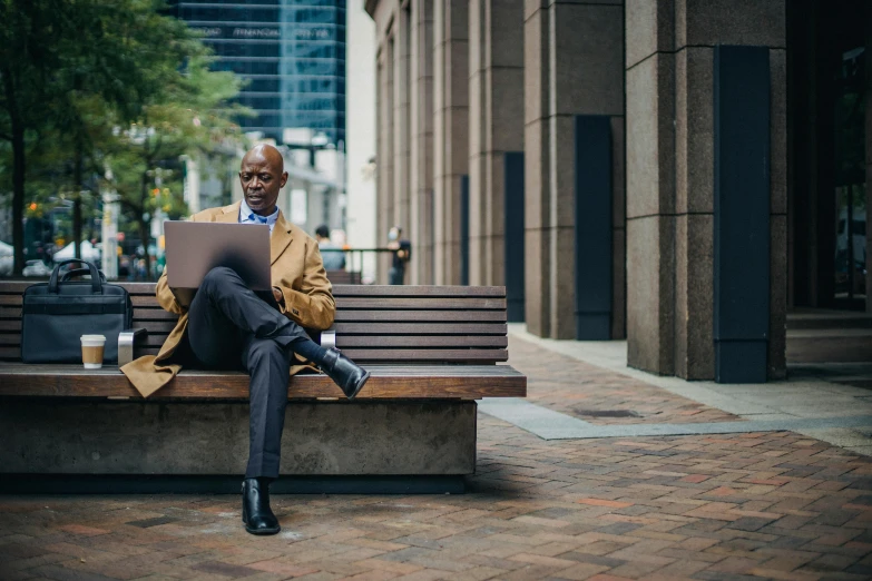 a man sitting on a bench using a laptop, by Carey Morris, pexels contest winner, renaissance, corporate memphis, looking smart, avatar image