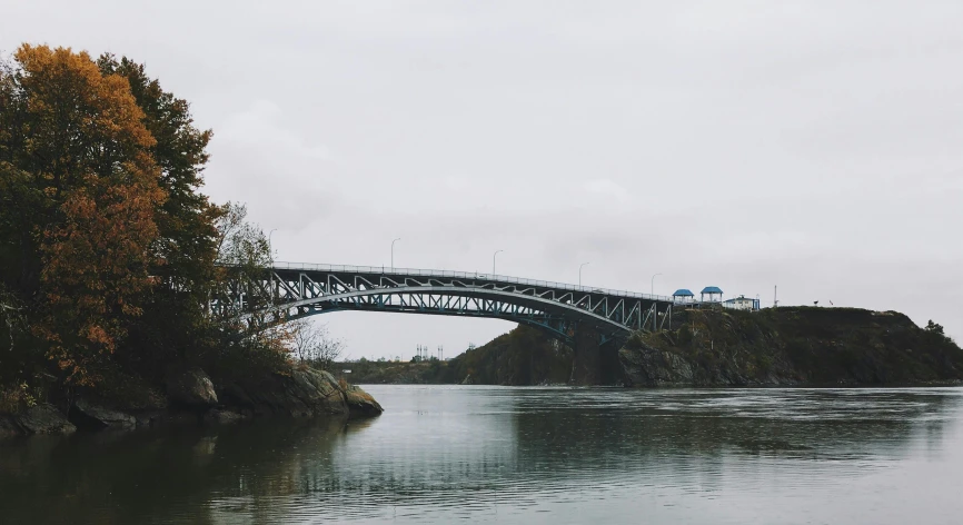 a bridge over a large body of water, by Jessie Algie, pexels contest winner, overcast gray skies, riverdale, victoria siemer, 2 5 6 x 2 5 6 pixels