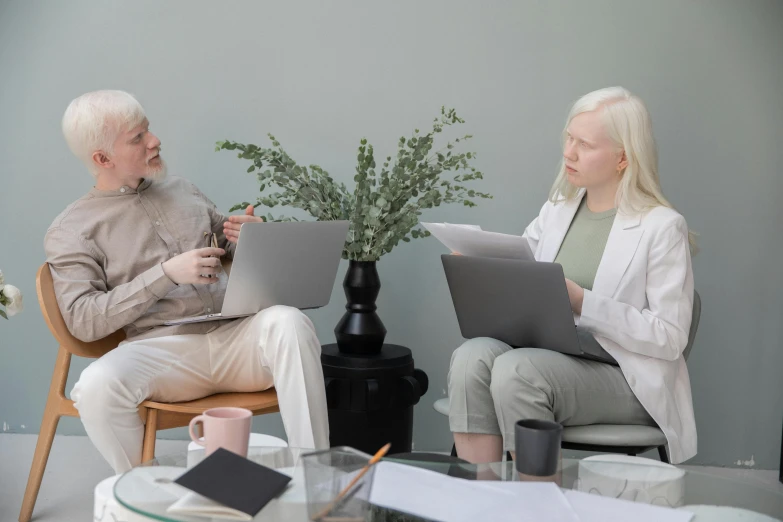 a man and a woman sitting in chairs with laptops, a photo, trending on pexels, analytical art, white-haired, medical image, pastel', npc talking