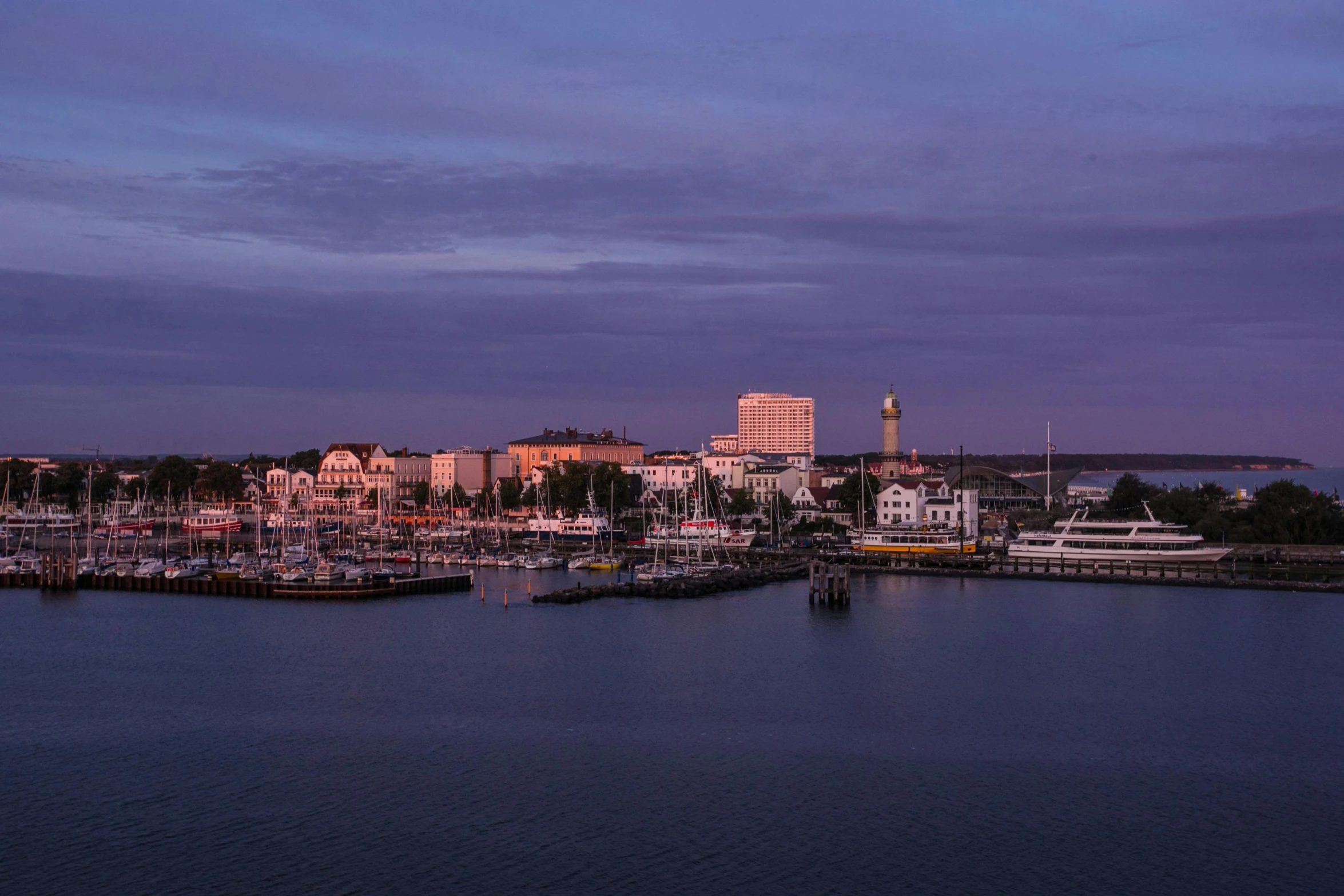 a harbor filled with lots of boats under a purple sky, long beach background, magic hour photography, 2022 photograph, gigapixel photo