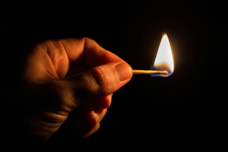 a hand lighting a match with a matchstick, pexels, gas lighting, profile picture, getty images, fan favorite