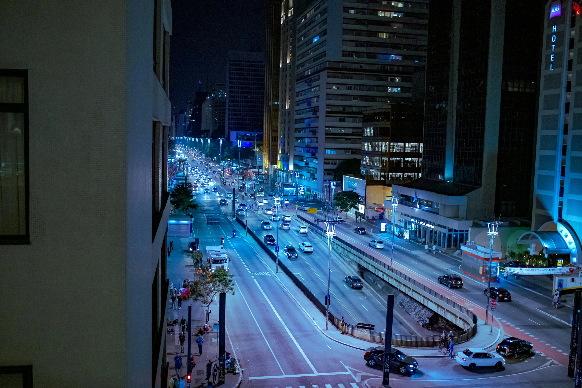 a city street filled with lots of traffic at night, by Felipe Seade, pexels contest winner, hyperrealism, in sao paulo, jeddah city street, gigapixel photo, multiple stories