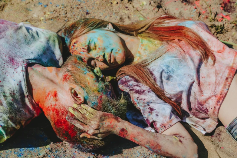 a couple of people laying on top of each other, a colorized photo, by Julia Pishtar, pexels contest winner, color field, some splattered paint, morbid colors, bodypaint, dead bodies