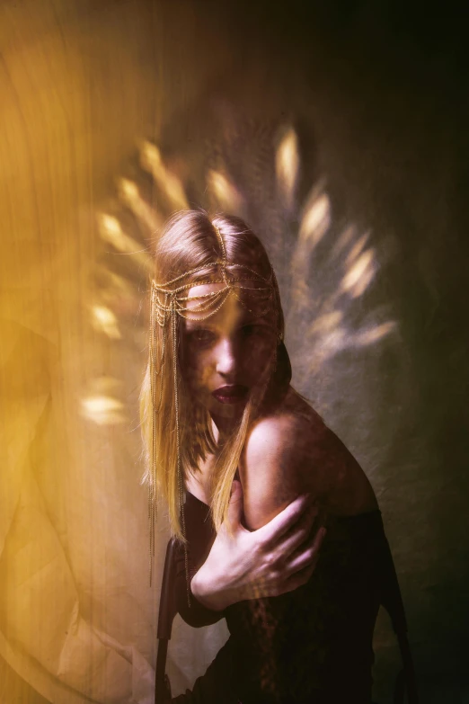 a woman in a black dress holding a gun, a polaroid photo, inspired by Brooke Shaden, pexels contest winner, light and space, gold wings on head, lensflares, a blond, yellow aura