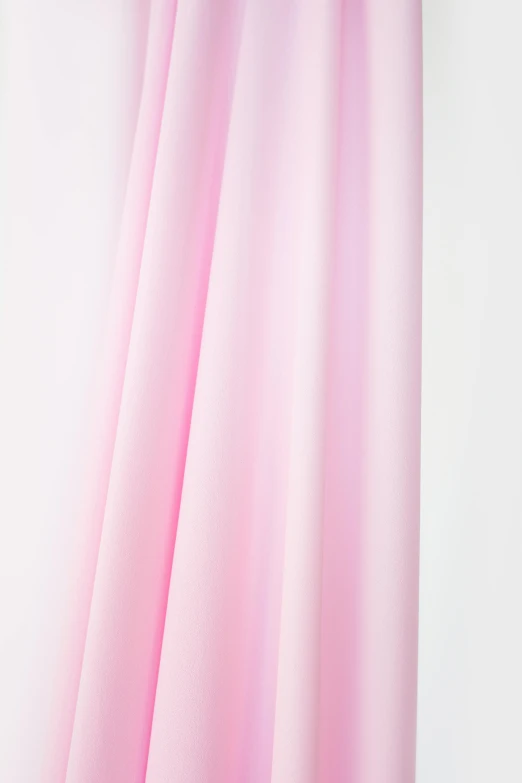 a pink curtain hanging on a white wall, opalescent mist, cotton fabric, with a white background, middle close up