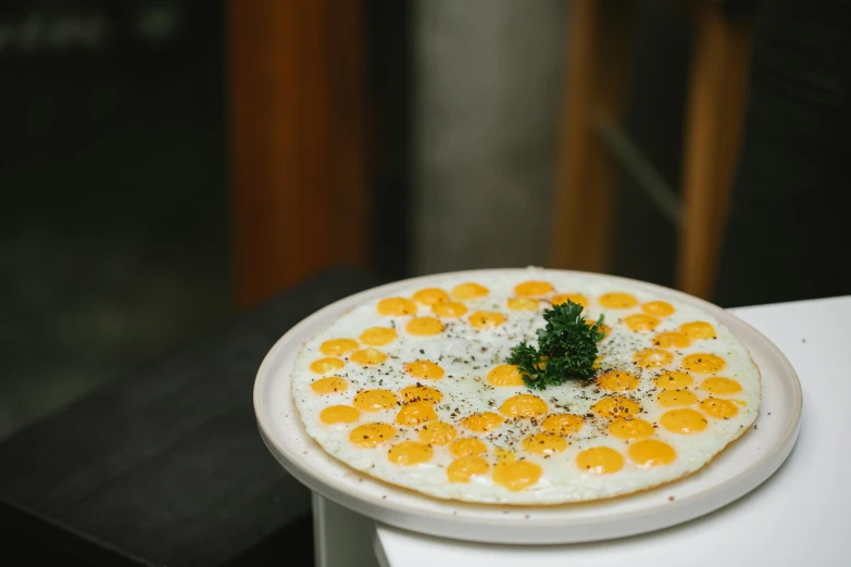 a close up of a plate of food on a table, unsplash, hurufiyya, egg yolk, made of swiss cheese wheels, ignant, in style of pan ren wei