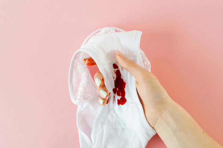 a person holding a napkin with food on it, by Julia Pishtar, plasticien, blood stains on shirt, cute panties, contracept, drip