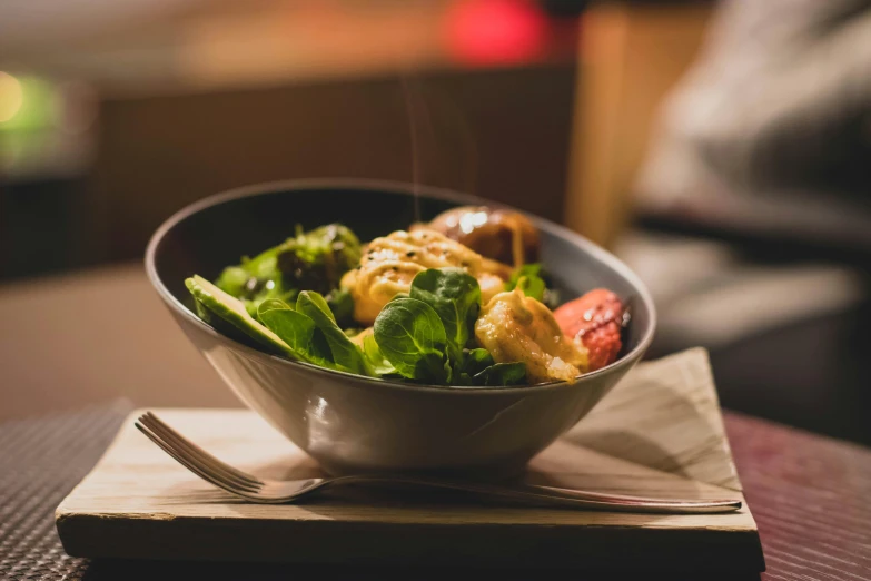 a close up of a bowl of food on a table, unsplash, cosy atmosphere, profile image, salad, michelin starred restaurant