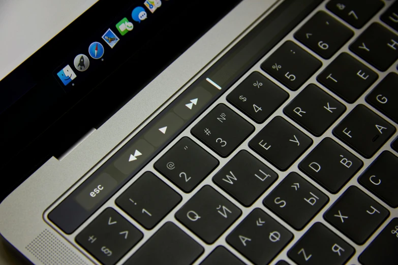 a close up of a laptop keyboard on a table, by Carey Morris, apple, slide show, oled, afp