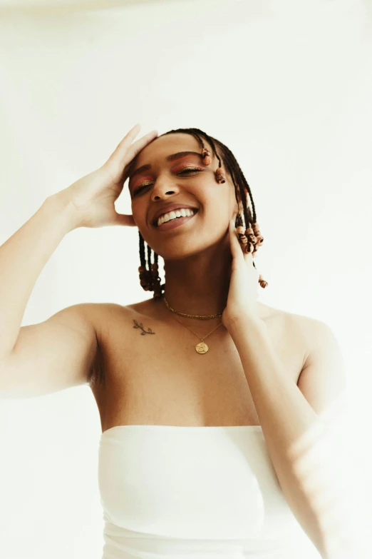 a woman in a white dress posing for a picture, an album cover, by Dulah Marie Evans, trending on pexels, renaissance, earing a shirt laughing, braids, reflective skin, wiz khalifa