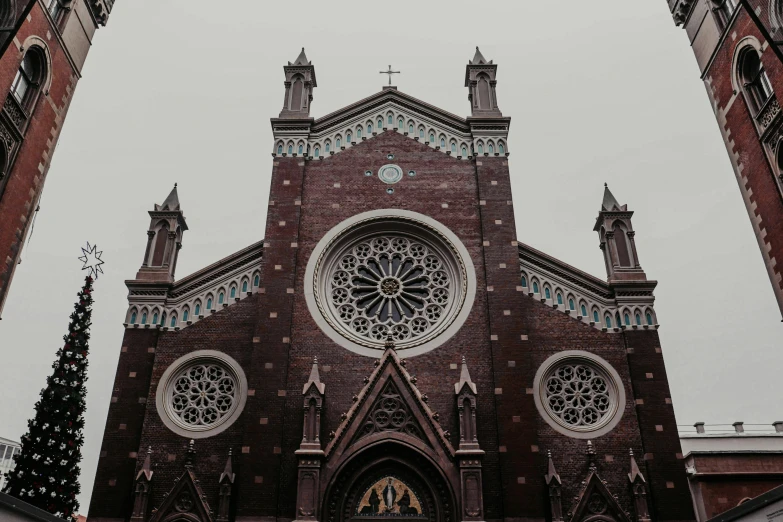 a church with a clock on the front of it, by Sebastian Vrancx, pexels contest winner, black and terracotta, seattle, front symetrical, gothic church background