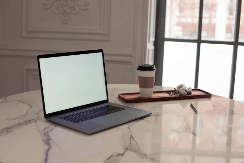 a laptop computer sitting on top of a marble table, a computer rendering, pexels, sitting on a mocha-colored table, grey, thumbnail, indoor shot