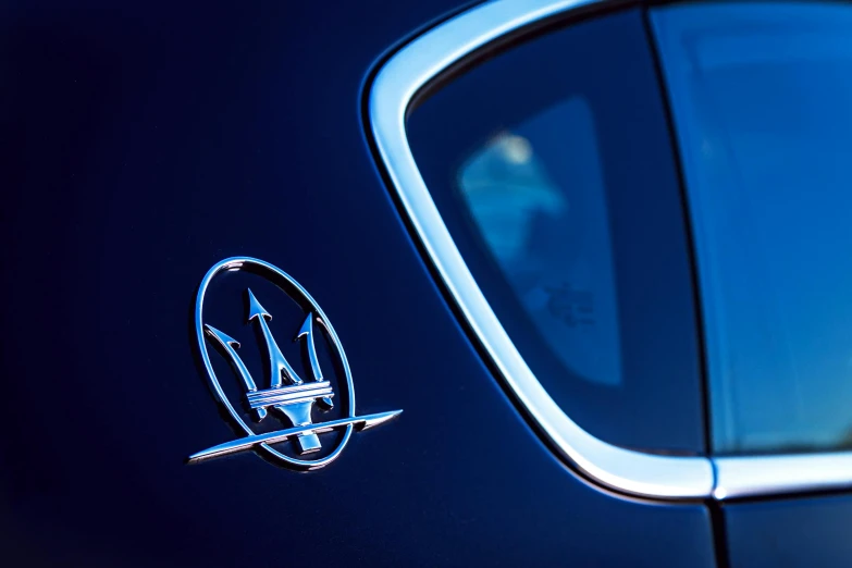 a close up of the emblem of a car, unsplash, henrik fisker, kobalt blue, with trident and crown, thumbnail