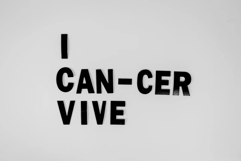 a black and white photo of a sign that says i can - cer vive, concrete poetry, the cure for cancer, outlive streetwear collection, background image
