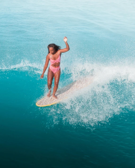 a woman riding a wave on top of a surfboard, pexels contest winner, renaissance, tan complexion, thumbnail, 1970s philippines, awarding winning