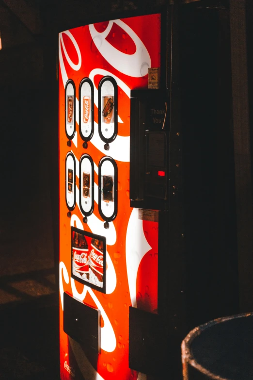 a close up of a vending machine on a street, by Dennis Flanders, pexels contest winner, orange red black white, summer night, chocolate, graphic print