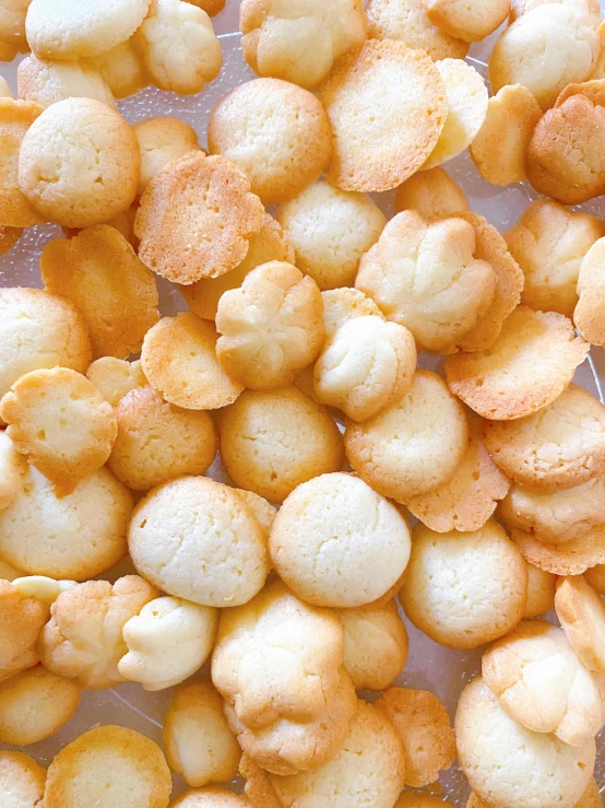 a pile of crackers sitting on top of a table, by Maeda Masao, reddit, rococo, puffballs, vanilla, no cropping, crisp clean shapes