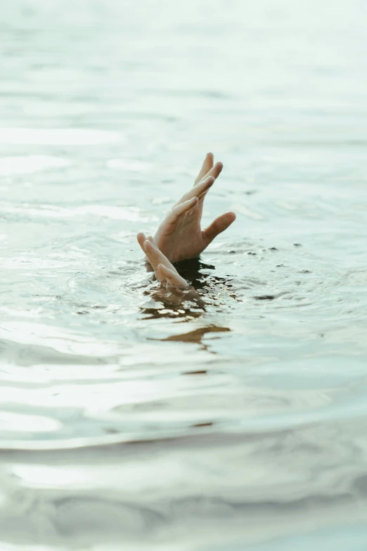 a person's hand reaching out of the water, pexels, tragedy, head down, ilustration, crashed