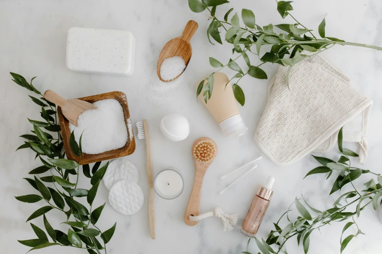 a bunch of items sitting on top of a marble counter, trending on pexels, dry brushing, eco-friendly theme, white backround, oily skin