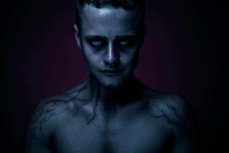 a man with tattoos on his chest and chest, a character portrait, pexels contest winner, antipodeans, dark blue skin, elijah wood as harry potter, ( apocalyptic ) 8 k, dark portrait of medusa