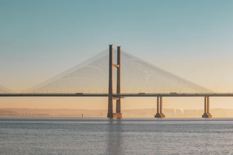a large bridge over a large body of water, by John Henderson, pexels contest winner, modernism, floating power cables, early in the morning, in style of norman foster, portrait of tall
