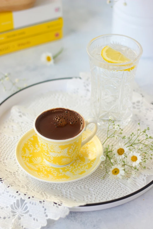 a yellow and white plate topped with a cup of coffee, fully chocolate, aykut aydogdu zener, summer feeling, soup