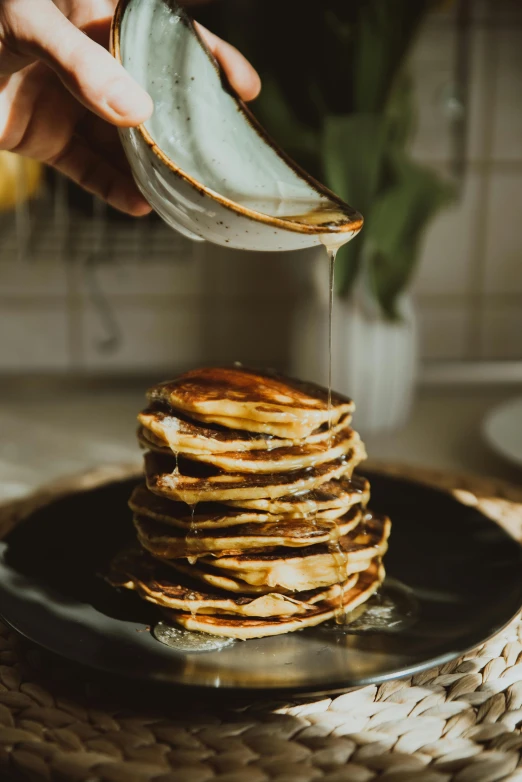 a person pouring syrup onto a stack of pancakes, unsplash, renaissance, award - winning crisp details ”, eco, kek, thumbnail