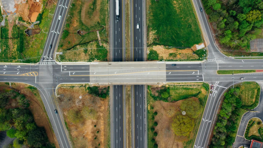 an aerial view of an intersection with multiple lanes, by Matt Cavotta, unsplash, realism, bridge, 15081959 21121991 01012000 4k, composite, ilustration