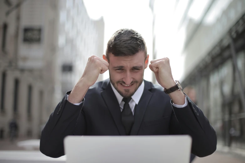 a man in a suit sitting in front of a laptop, a screenshot, pexels contest winner, agitated, lachlan bailey, strong emotional impact, 555400831