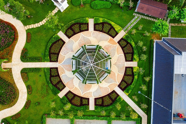 a bird's eye view of a circular garden, pexels contest winner, star roof, shipibo, helipad, half image