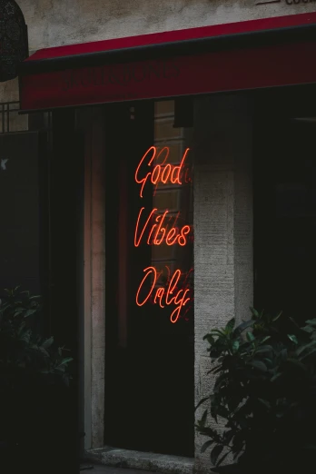 a neon sign that says good vibe only, pexels contest winner, tall windows lit up, spiritual vibes, profile picture, low quality photo
