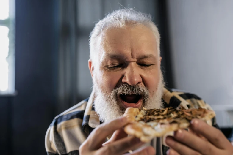 a man with a beard eating a piece of pizza, by Will Ellis, pexels contest winner, portrait of hide the pain harold, a silver haired mad, 15081959 21121991 01012000 4k, lachlan bailey