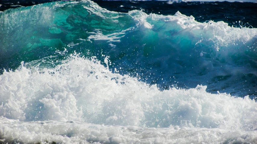 a person riding a surfboard on a wave in the ocean, pexels contest winner, blue crashing waves, glistening seafoam, a close-up, aquamarine