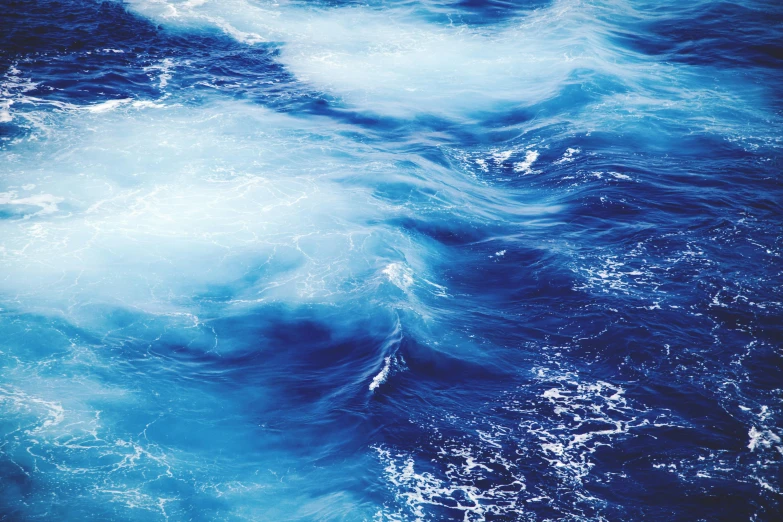 a close up of a body of water with waves, an album cover, unsplash, bright deep blue, turbulence, instagram post, facebook post