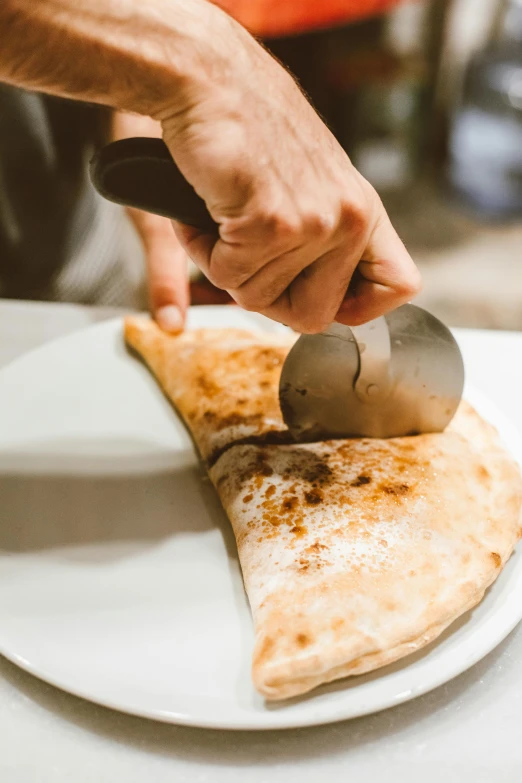 a person cutting a piece of pizza on a plate, spatula, flat pancake head, subtle detailing, holding axe