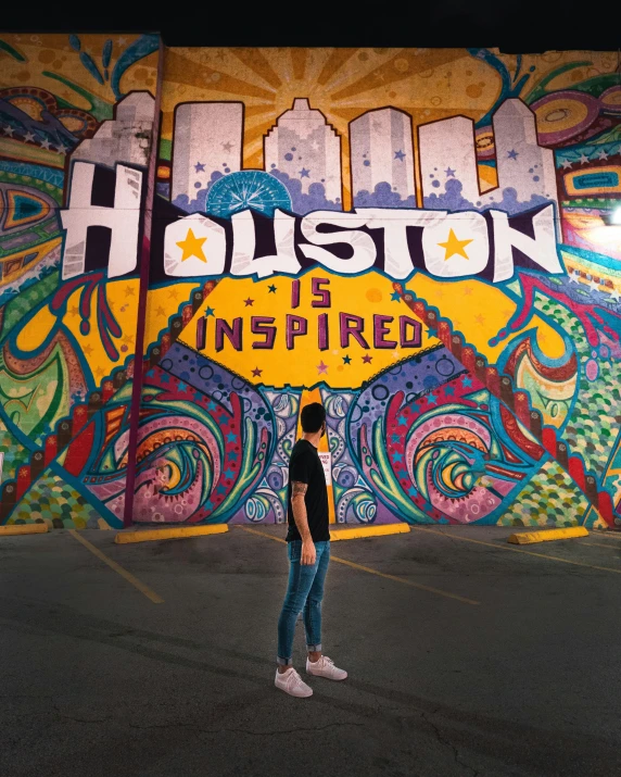 a person standing in front of a colorful mural, posing for a picture, justin sun, city backdrop, on a dark background