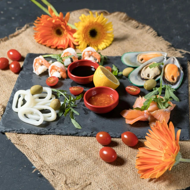 a close up of a plate of food on a table, slate, detailed product image, marsterpiece, maritime