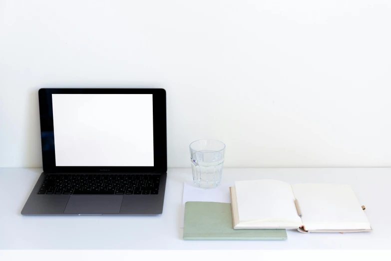 a laptop computer sitting on top of a white desk, by Carey Morris, paper, with clear glass, thumbnail, laptops