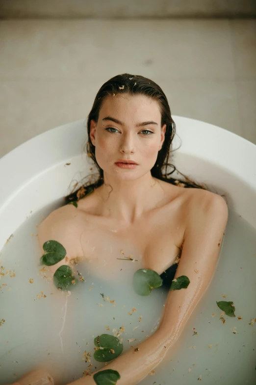 a beautiful young woman sitting in a bath tub, inspired by Elsa Bleda, unsplash, renaissance, yvonne strahovski, with seaweed, miranda kerr, creamy skin