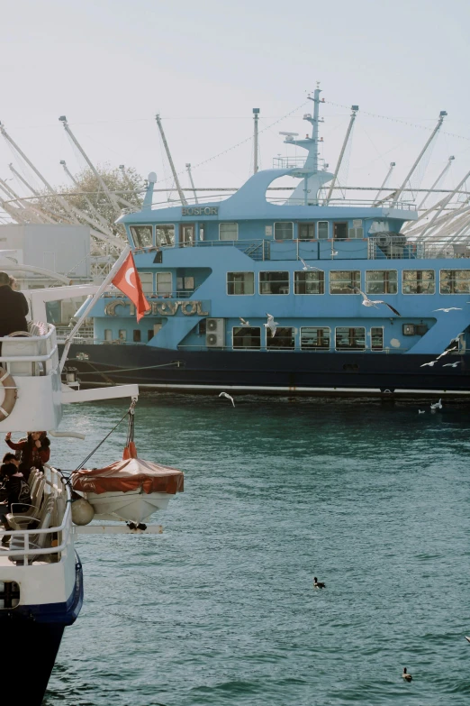 a couple of boats that are in the water, by Yasushi Sugiyama, happening, istanbul, blue themed, 1990s photograph, on ship