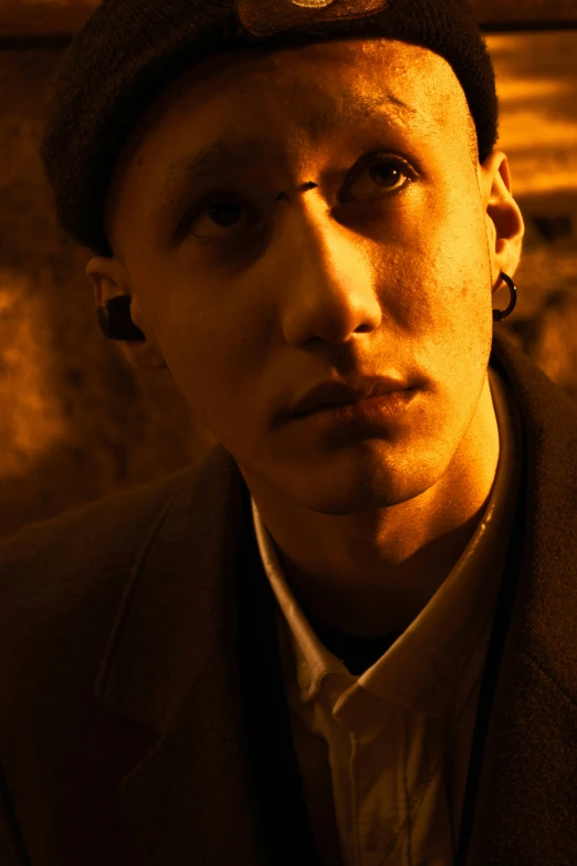 a close up of a person wearing a hat, inspired by Gyula Basch, in a cave. underexposed, shaven, berets, piercing gaze