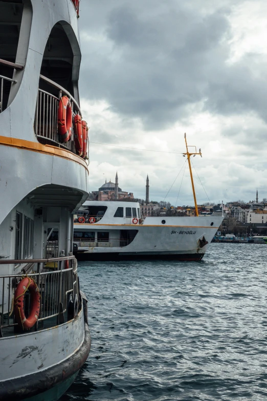 a couple of boats that are in the water, pexels contest winner, art nouveau, fallout style istanbul, grey, outside view, 2022 photograph
