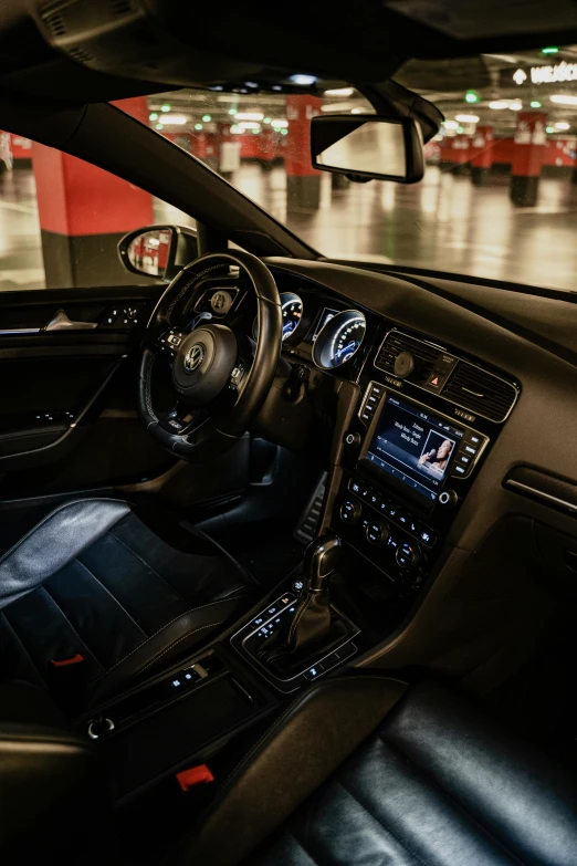 the interior of a car in a parking garage, unsplash, happening, wrx golf, black leather accents, 2 0 % pearlescent detailing, black horns